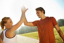 man and woman high five