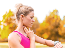 woman taking heart rate