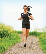 woman running outside on a trail
