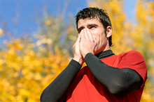 man warming hands outside