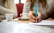 group of women filling out paperwork