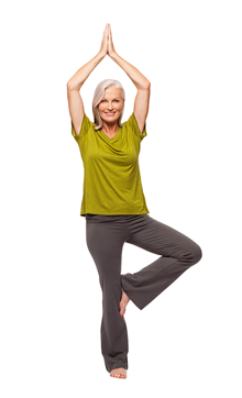 woman balancing on one foot with arms up