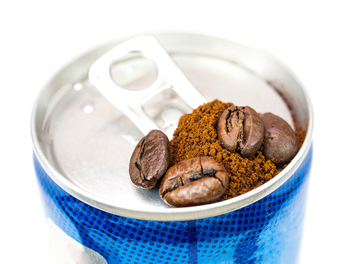 energy drink can with coffee on top