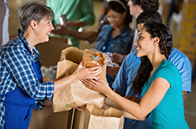 volunteer serving food at a food bank