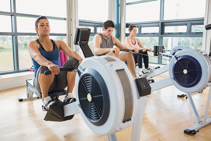 People working out on row machines