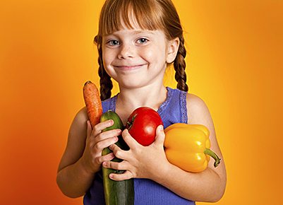 girl with pigtails and veggies