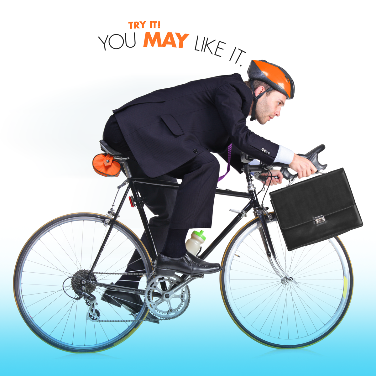 man in a suit with a briefcase riding a bike