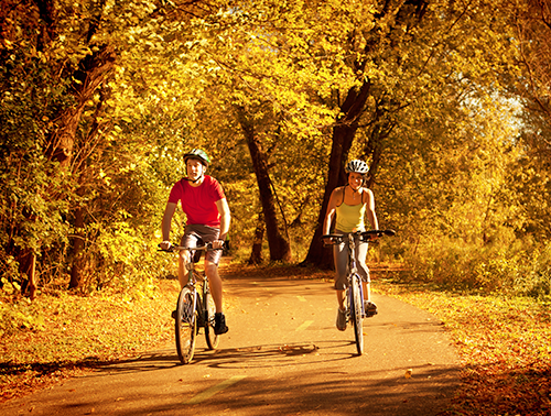 adult biking in the fall