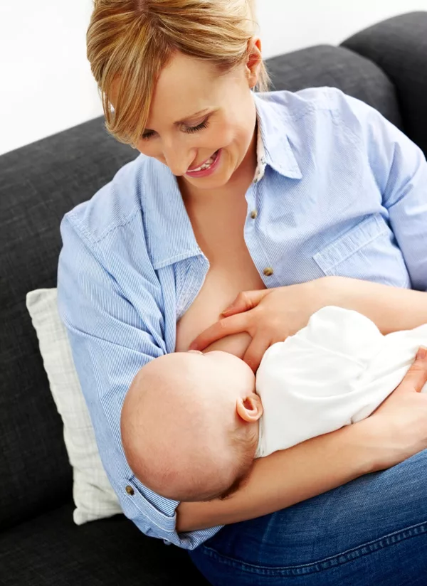 A mother breastfeeding at work
