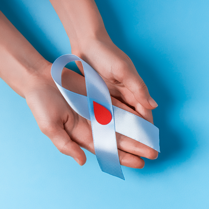 Hands holding a diabetes awareness ribbon