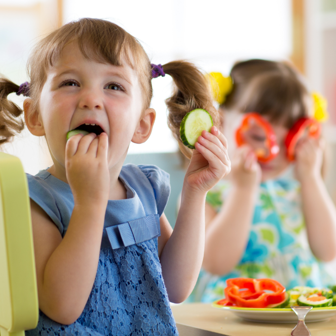 Toddlers eating healthy at daycare