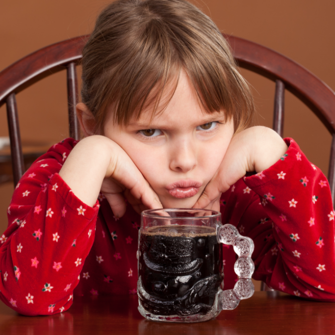 feisty kid with a soda