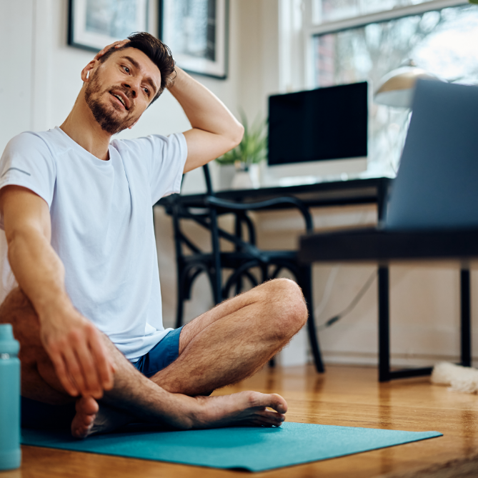 man stretching at home