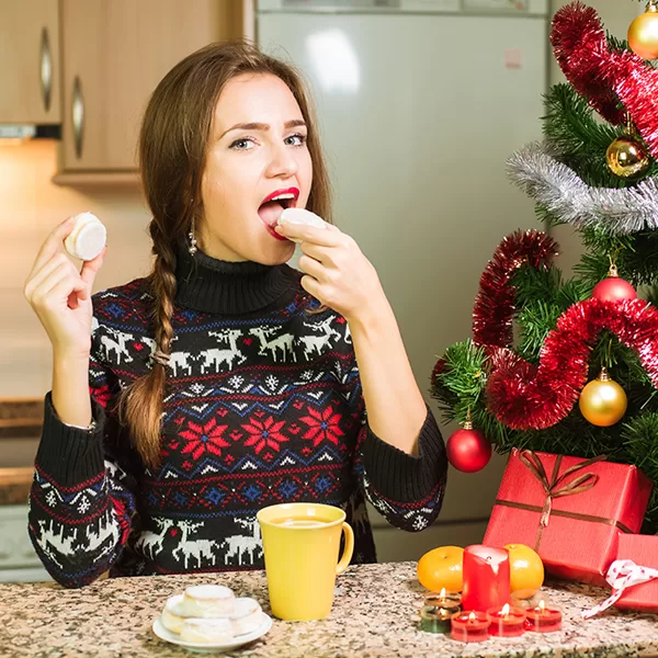 Woman snacking during holiday season.